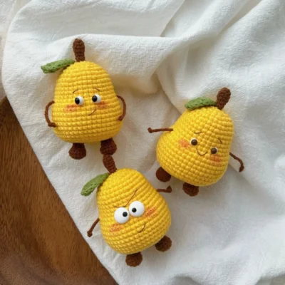 three crochet pear on table